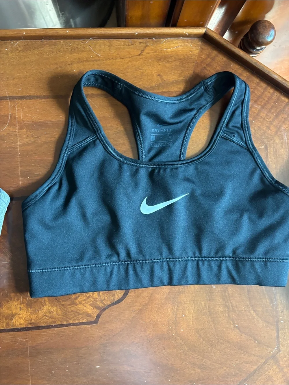 2 Nike and 1 pink Victoria’s Secret Gray Dri-FIT Racerback Sports Bra